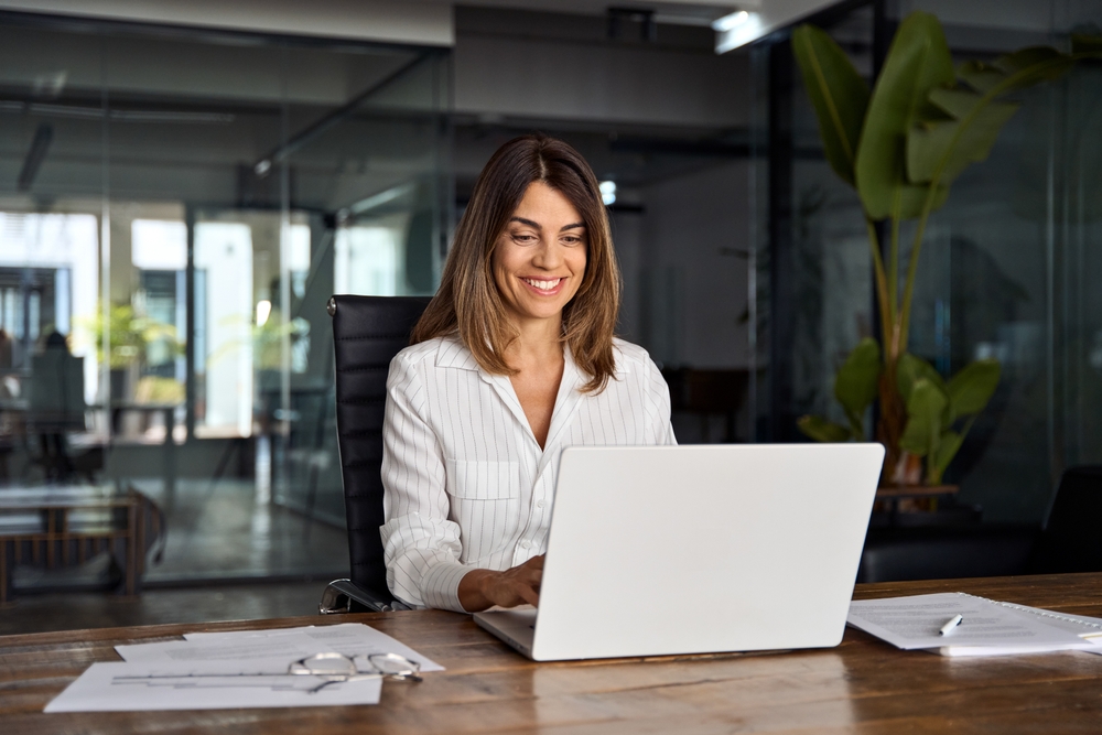 Woman typing on laptop